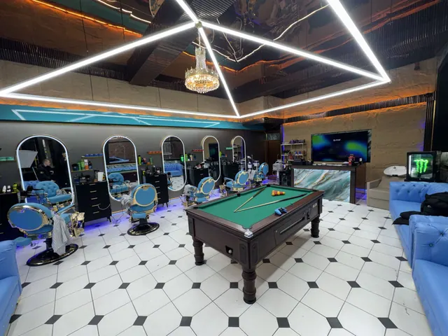 Inside Barber Club: the chairs, pool table and light-strip ceiling